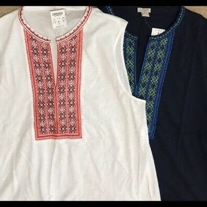 Navy blue top with blue and green embroidery.